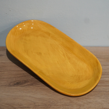 Petite assiette ovale en céramique                                    